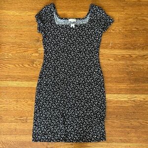 Black mini dress with white floral print and bow